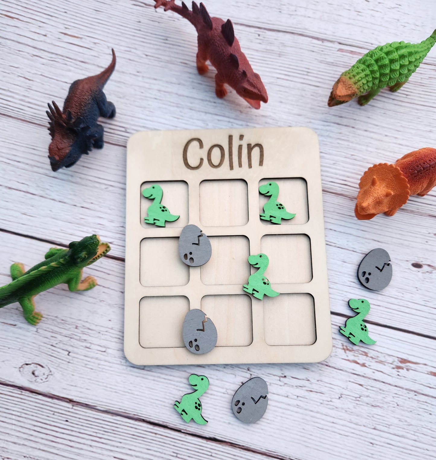 Dinosaur tic tac toe board game