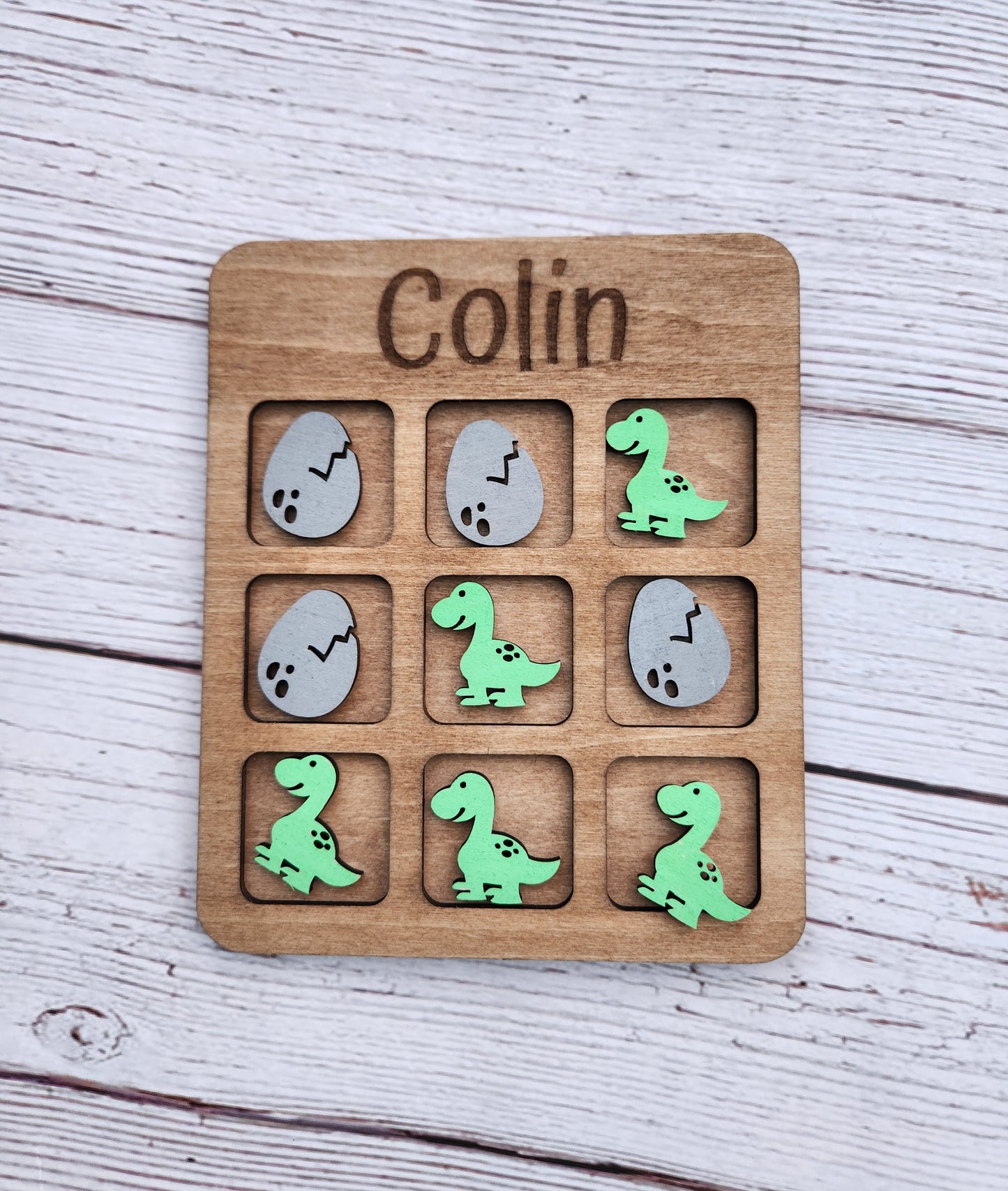 Dinosaur tic tac toe board game