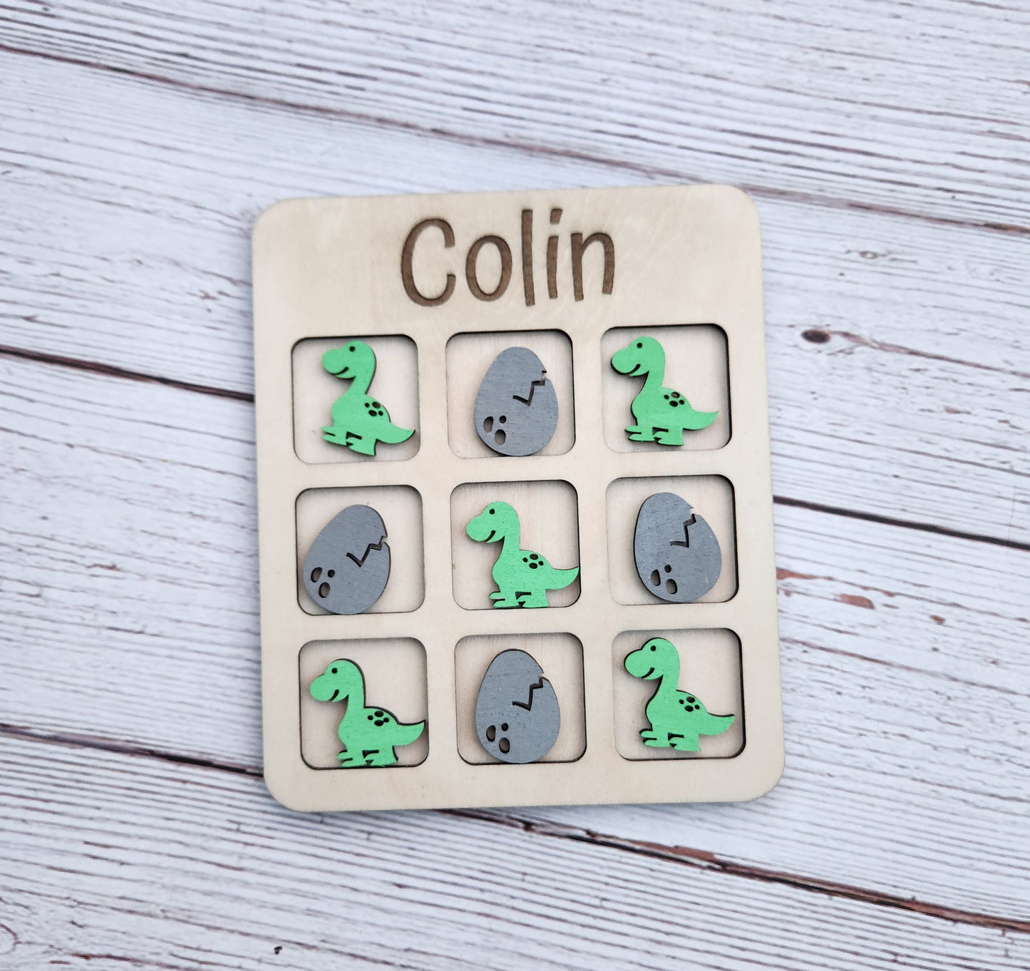 Dinosaur tic tac toe board game